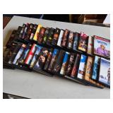 Lot of DVDs including "Pirates of the Caribbean," "Inception," and "Edward Scissorhands," among others