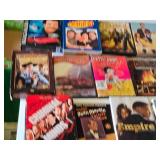 DVD and CD collection including Magnum P.I., Seinfeld, Tin Man, Burn Notice, Batman, and more
