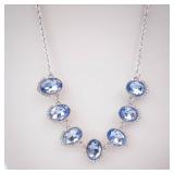Blue Oval Crystal Necklace with Halo Setting on Silver Chain