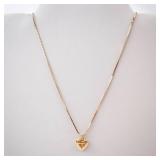 Gold-Tone Engraved Cross Heart Locket Necklace.