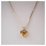 Gold-Tone Engraved Cross Heart Locket Necklace.