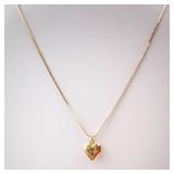 Gold-Tone Engraved Cross Heart Locket Necklace.