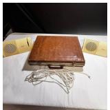 Vintage Bose speaker set with briefcase filled with cassette tapes
