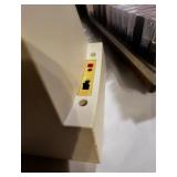 Vintage Bose speaker set with briefcase filled with cassette tapes