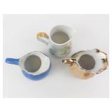 Three Miniature Ceramic Pitchers Set - Blue Scenic, Peach Pattern White, Gold Trim