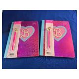 2 Composition book with pen