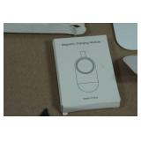 Asssortment of Apple Watch Bands and Charger