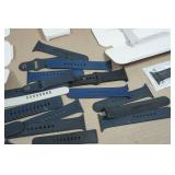 Asssortment of Apple Watch Bands and Charger