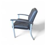 Lorell healthcare reception guest chair featuring black antimicrobial vinyl upholstery and a silver powder-coated steel frame.