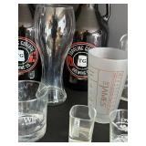 Toppling Goliath Growlers (2) & Leroux Brandy Bottle & Assorted Glassware