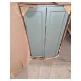 Forest green pantry cabinet and wall cabinet