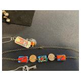 Assorted Trendy Necklaces & Pendants - Agate Slices, Enamel Tiles, Beads in a Display Case