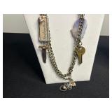 Lariat Necklaces & Vintage Costume Jewelry with Key Charms in Display Case