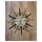 Starburst Wall Clock - Navy & Gold Spokes with Amber Accents, 12-Hour Dial