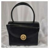 Black Structured Top Handle Handbag With Gold Clasp