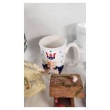 Assorted Vintage Collectible Items including Uncle Sam Mug, Decorative Plates, and Figurines