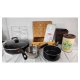 Assorted Kitchenware Items Including Mirro and Revere Ware Pots, T-fal Pan, Rubbermaid Ice Cube Tray, and Decorative Canister