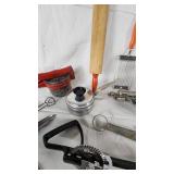 Vintage Kitchen Utensil Collection including Potato Ricer, Rolling Pin, and Hand Mixer