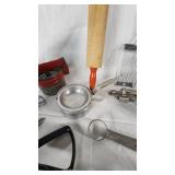 Vintage Kitchen Utensil Collection including Potato Ricer, Rolling Pin, and Hand Mixer