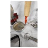 Vintage Kitchen Utensil Collection including Potato Ricer, Rolling Pin, and Hand Mixer