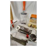 Vintage Kitchen Utensil Collection including Potato Ricer, Rolling Pin, and Hand Mixer