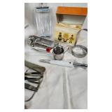 Vintage Kitchen Utensil Collection including Potato Ricer, Rolling Pin, and Hand Mixer