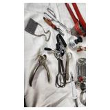 Vintage Kitchen Utensil Collection including Potato Ricer, Rolling Pin, and Hand Mixer