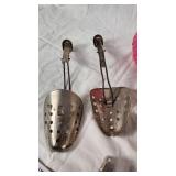 Plastic Pink Poodle, Wooden Shoe Stretchers, and Metal Shoe Stretchers