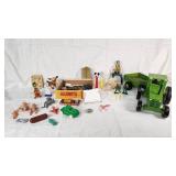 Assorted Toys and Collectibles Including John Deere Tractor, Action Figures, and Accessories