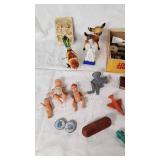 Assorted Toys and Collectibles Including John Deere Tractor, Action Figures, and Accessories