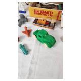 Assorted Toys and Collectibles Including John Deere Tractor, Action Figures, and Accessories