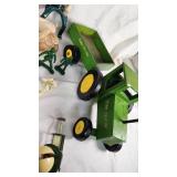 Assorted Toys and Collectibles Including John Deere Tractor, Action Figures, and Accessories