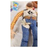 Eternal Revenue Man Coin Bank, Buzz Lightyear Mini Buddy, and Woody Doll