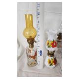 Collection of Vintage Oil Lamps with Colorful Glass and Metal Features
