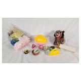 Plush Dog Toy (back legs broken), Yellow Stapler, Easter Egg, and Miscellaneous Items