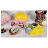 Plush Dog Toy (back legs broken), Yellow Stapler, Easter Egg, and Miscellaneous Items