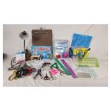 Office supplies including lamp, scissors, rulers, pens, and stencils
