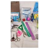 Office supplies including lamp, scissors, rulers, pens, and stencils