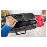 Tan Duffel Bag, Black Leather Bag, and Red Travel Bag