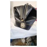 Tan Duffel Bag, Black Leather Bag, and Red Travel Bag