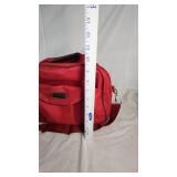 Tan Duffel Bag, Black Leather Bag, and Red Travel Bag