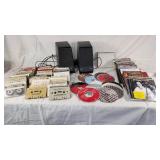 Collection of Cassette Tapes, CDs, and Speakers