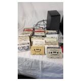 Collection of Cassette Tapes, CDs, and Speakers