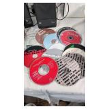 Collection of Cassette Tapes, CDs, and Speakers