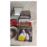 Collection of Cassette Tapes, CDs, and Speakers