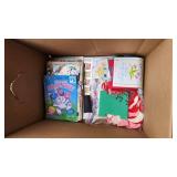 Craft Supplies and Holiday Decorations including Yarn, Wrapping Paper, and Quilting Magazines with rolling drawer plastic cabinet