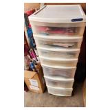 Craft Supplies and Holiday Decorations including Yarn, Wrapping Paper, and Quilting Magazines with rolling drawer plastic cabinet