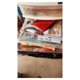 Craft Supplies and Holiday Decorations including Yarn, Wrapping Paper, and Quilting Magazines with rolling drawer plastic cabinet