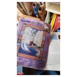 Craft Supplies and Holiday Decorations including Yarn, Wrapping Paper, and Quilting Magazines with rolling drawer plastic cabinet