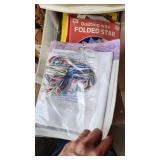 Craft Supplies and Holiday Decorations including Yarn, Wrapping Paper, and Quilting Magazines with rolling drawer plastic cabinet